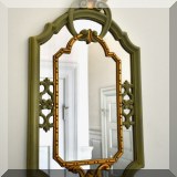 D03. Small mirror with green and gold painted frame.  